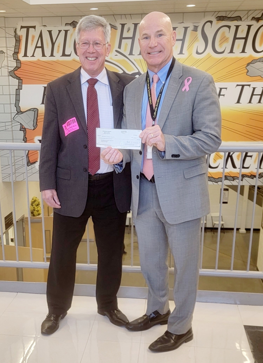 Dr. Ault accepting check from Knights of Columbus