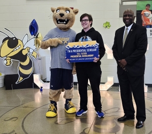 Max is joined by the mascot and President of Mount. St. Joseph